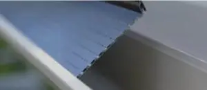 Alu-Rex gutter guard installation by Omnia Roofing, providing long-lasting aluminum gutter protection solution