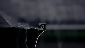 Alu-Rex DoublePro Gutter Guard protecting home gutters from clogs and water overflow during heavy rain